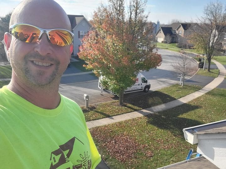 IHC crew member inspecting a roof in McHenry County — cedar shake roof insurance guide