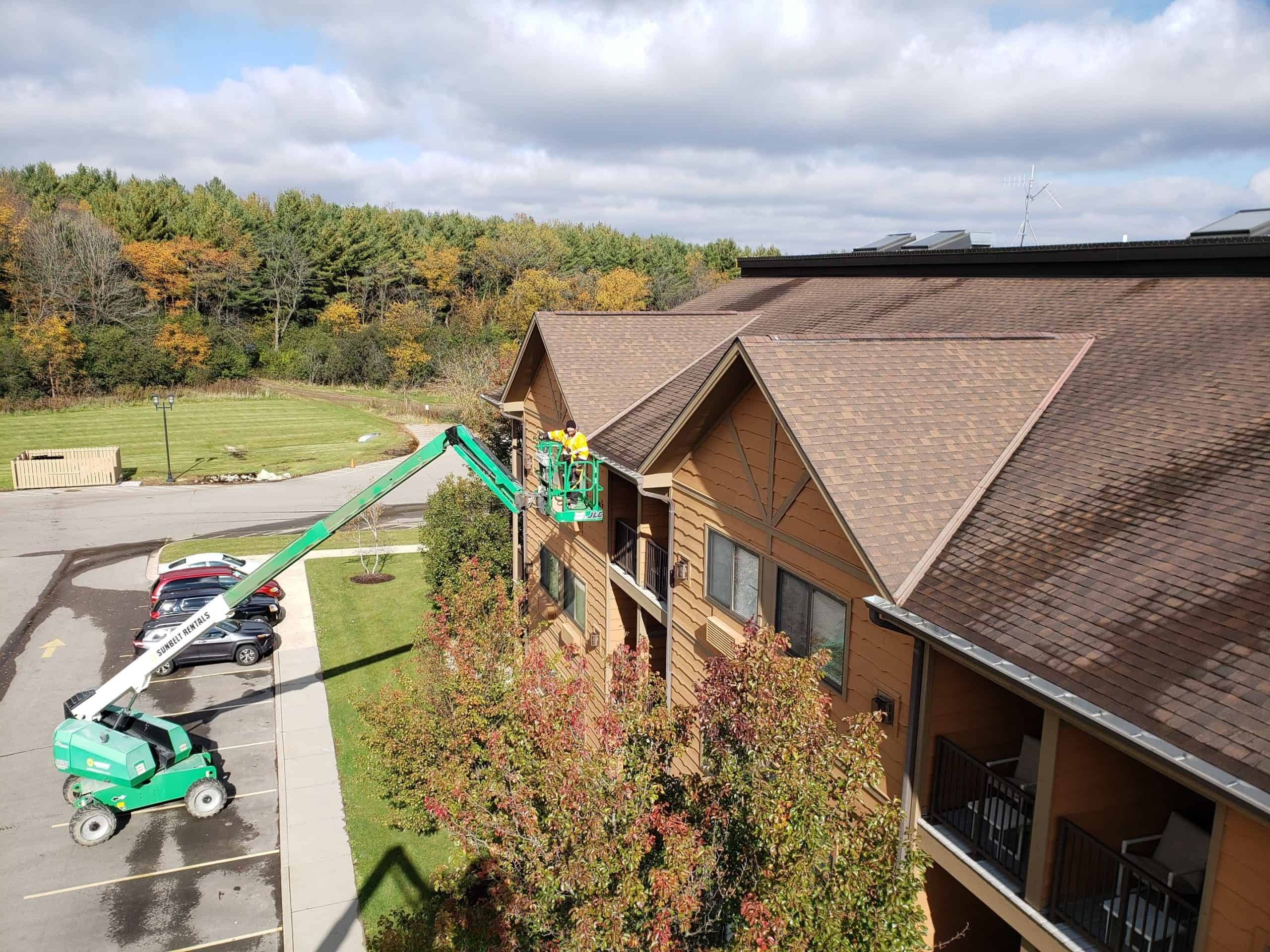 Rick installing a commercial gutter with a crane