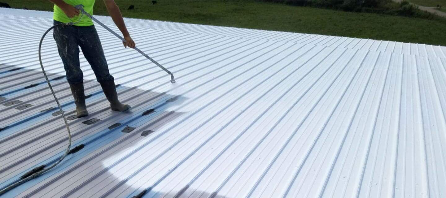 Commercial elastomeric roof coating application on flat roof in McHenry County IL