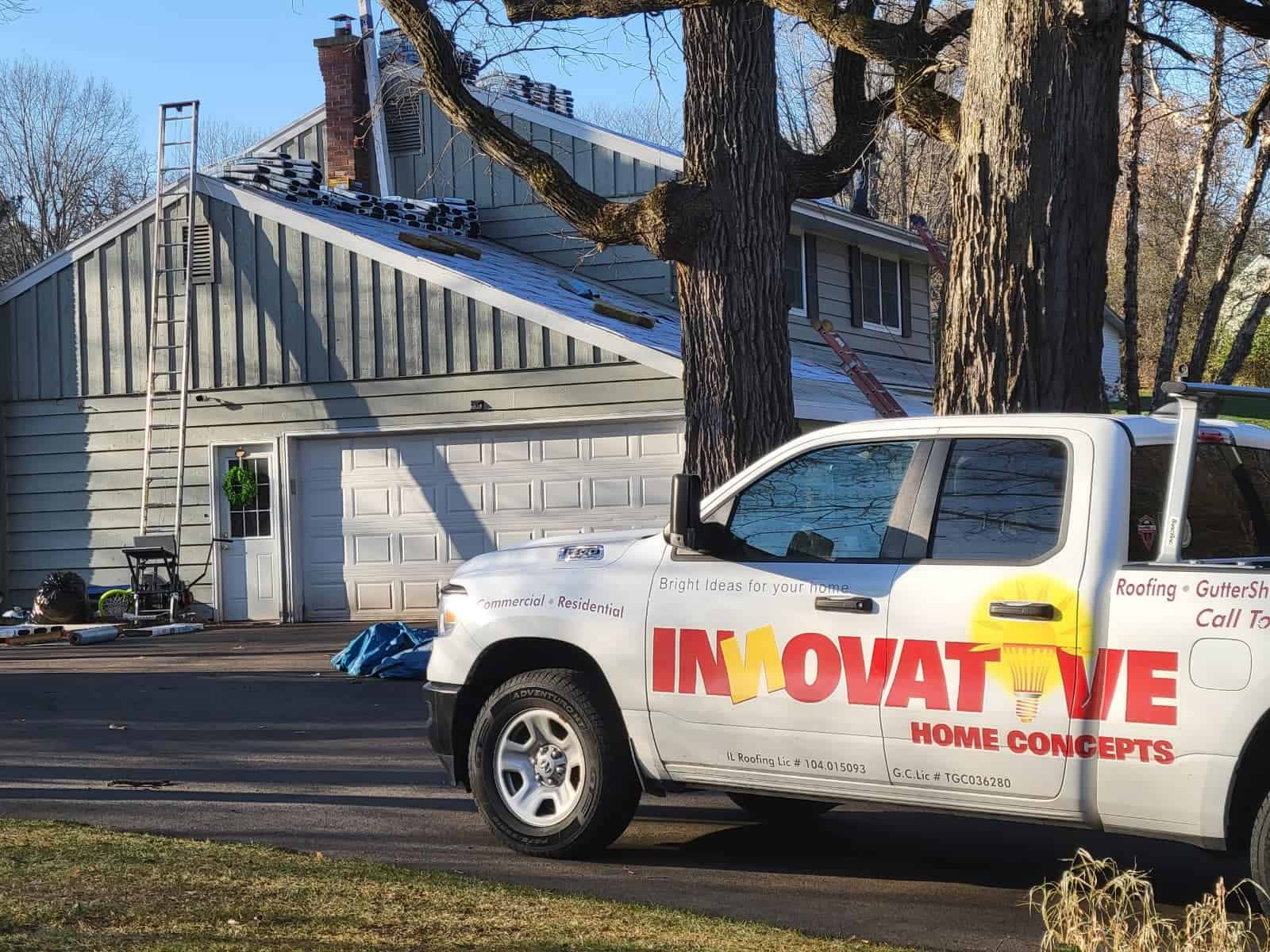 Roof replacement after storm damage with IHC truck on site