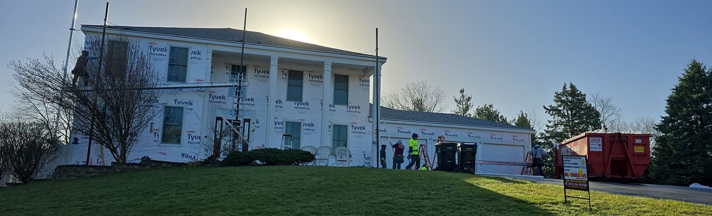 IHC crew installing James Hardie fiber cement siding on a Crystal Lake home