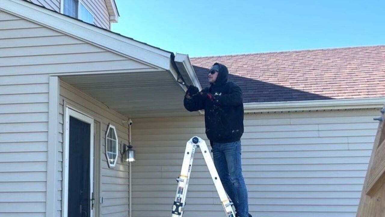 guy installing new gutters gutter installation