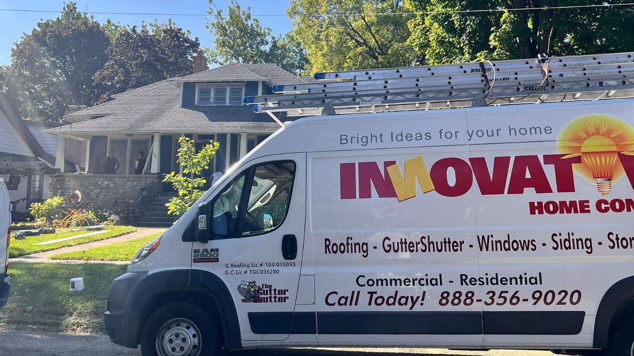 Siding installation crew working on a house in Woodstock