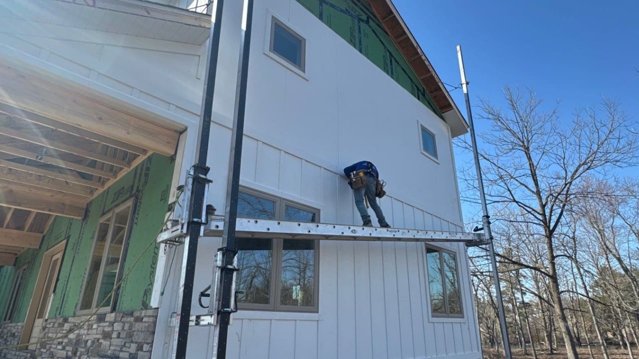 LP Smartside Siding Installation. Siding installer installing board and batton siding