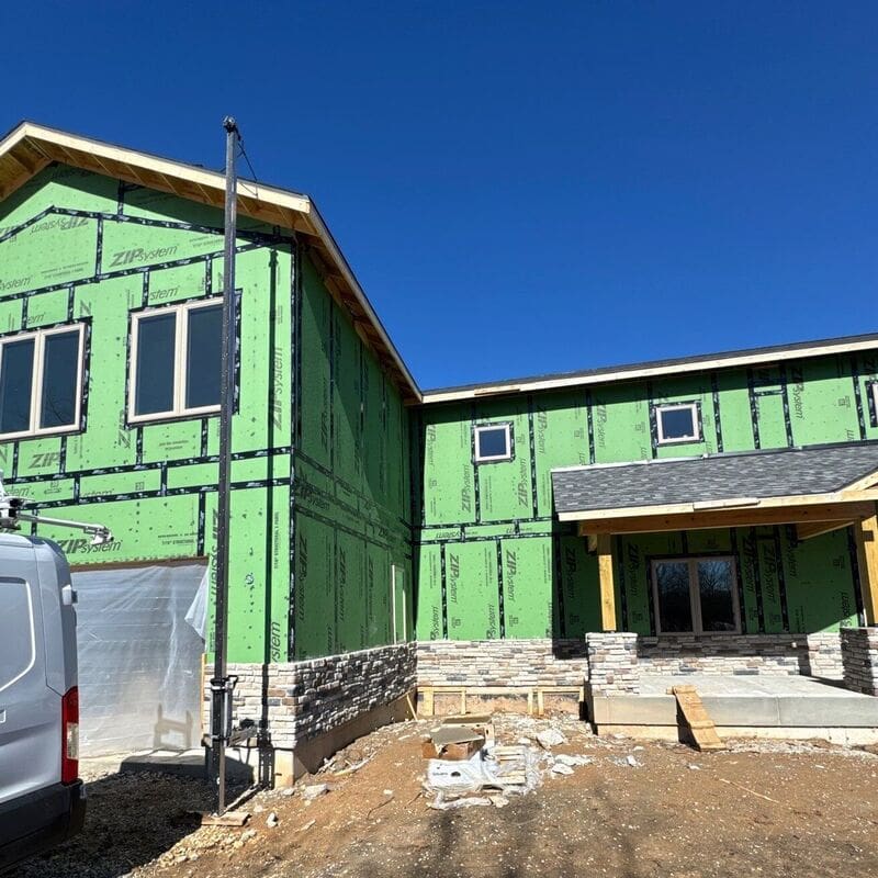 New Construction Home Before Before picture of new construction home. Stone is started, siding going on next.
