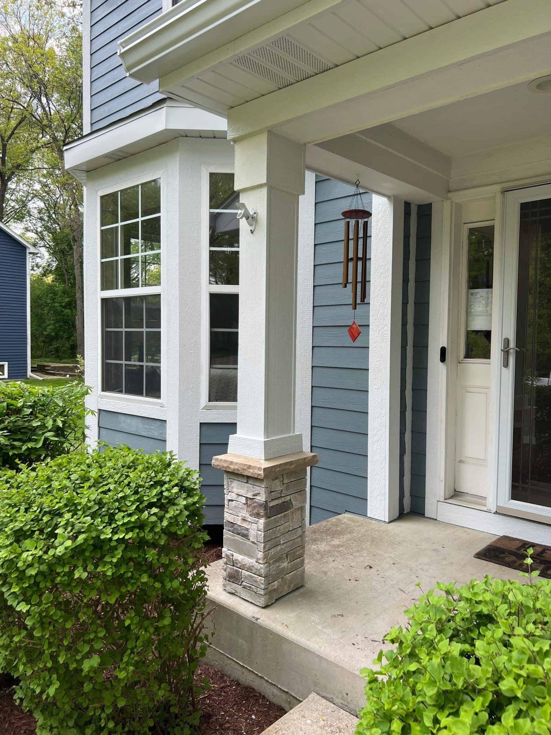 Front entrance with Hardie lap siding and stone column accents