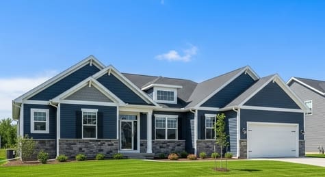 Earthy Green Vinyl Siding A beautiful home with on-trend earthy green vinyl siding, surrounded by trees in McHenry County.
