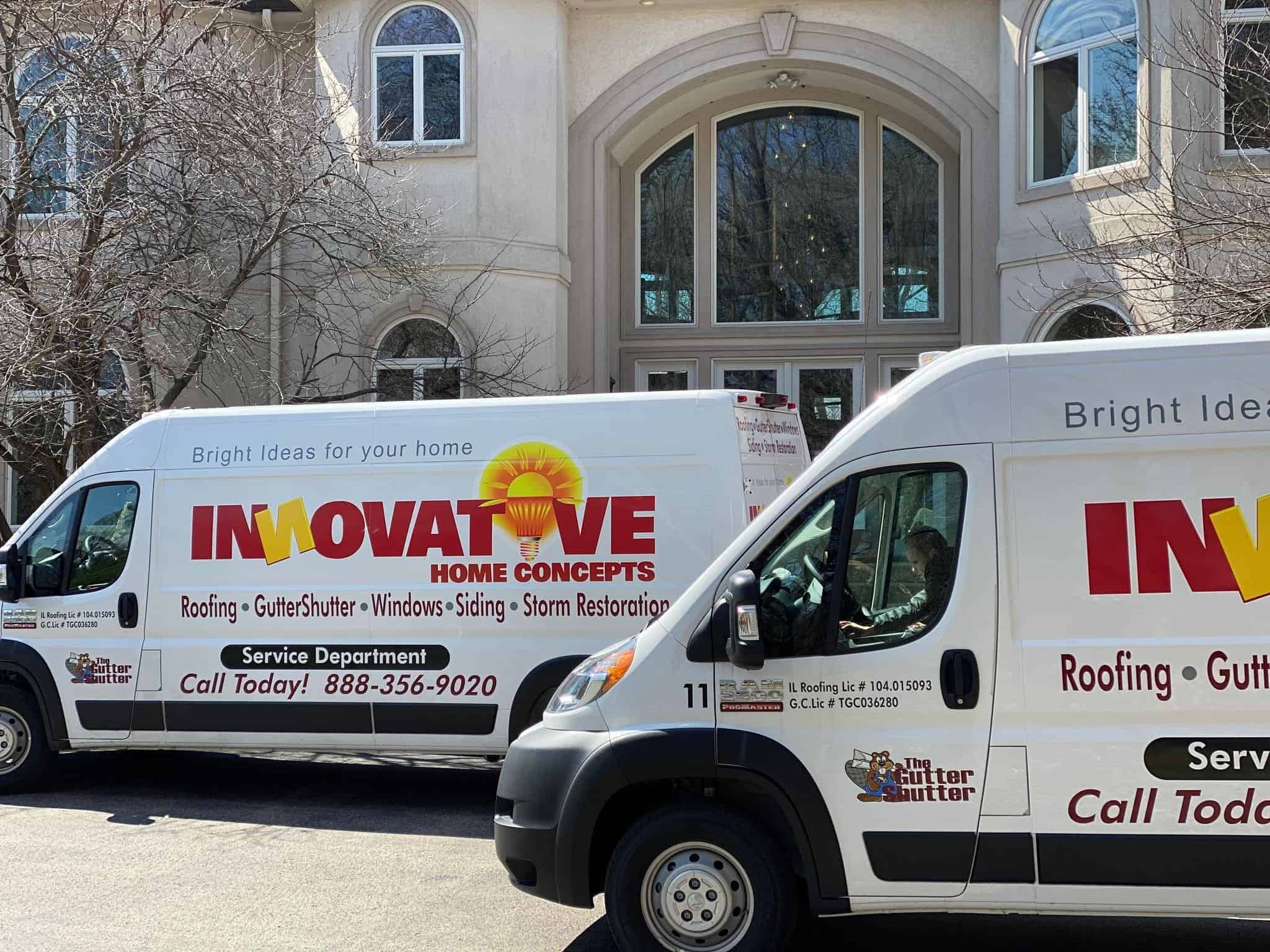 IHC vans in front of large Barrington area estate during siding project