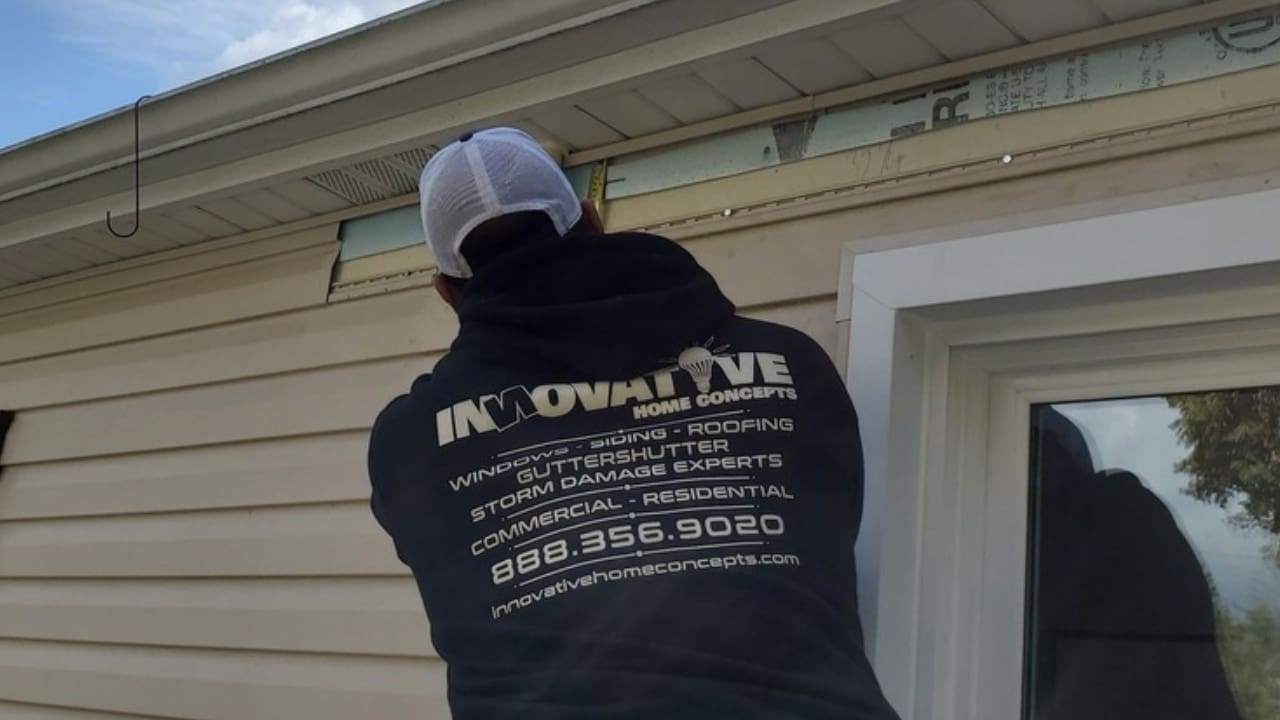 Rhett-Wilborn-Inspecting-Gutter-Installation-Roofing.jpg Rhett Wilborn inspecting a Gutter Shutter installation and roofing project to ensure quality standards.