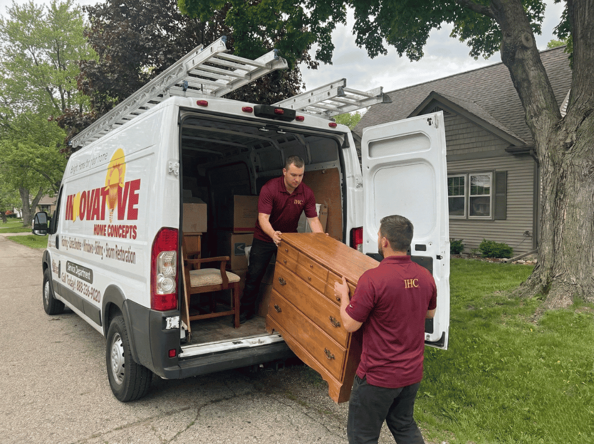 IHC crew loading furniture and household items into a truck during a residential property cleanout in Crystal Lake, IL