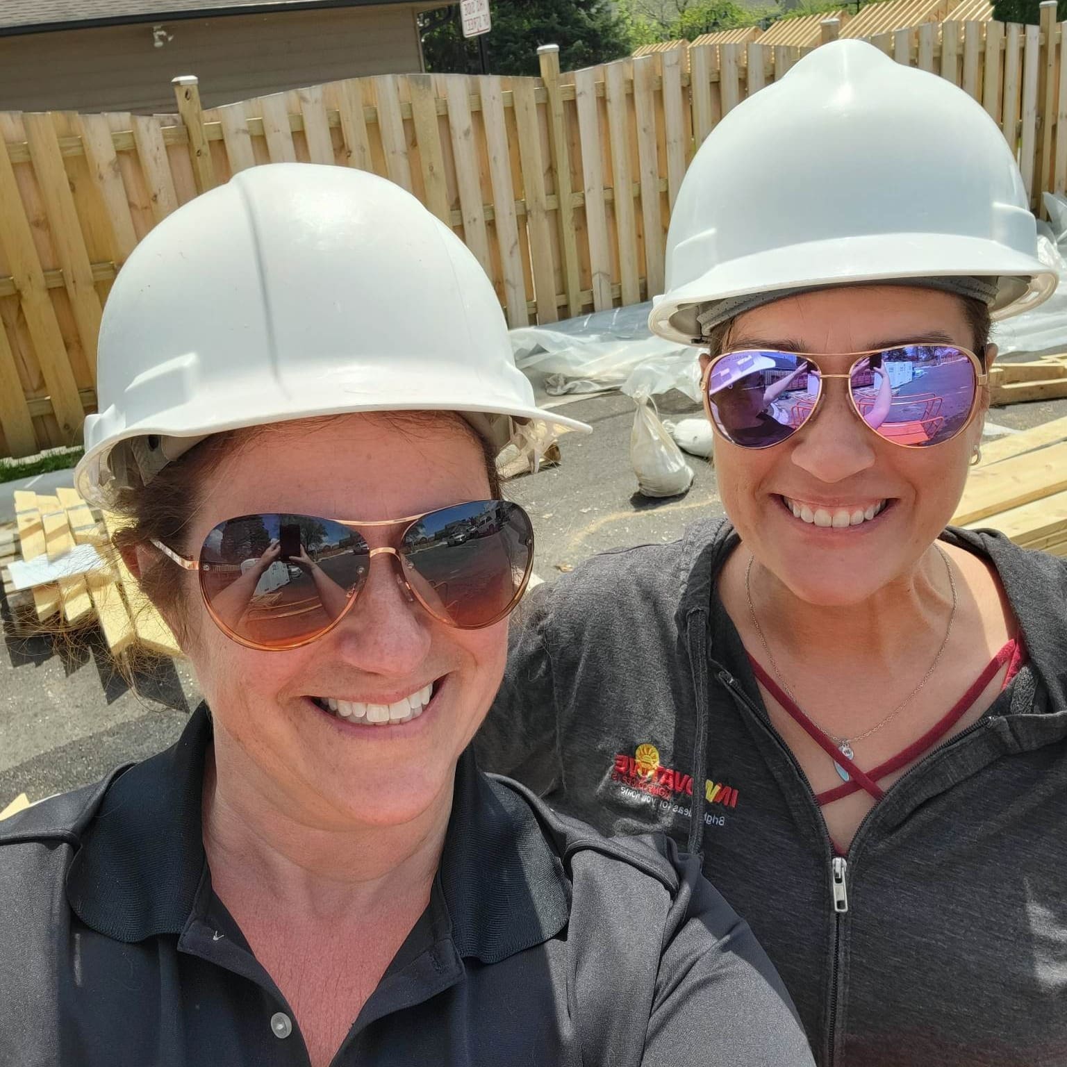 IHC team members Courtney and Linda visiting a commercial gutter installation