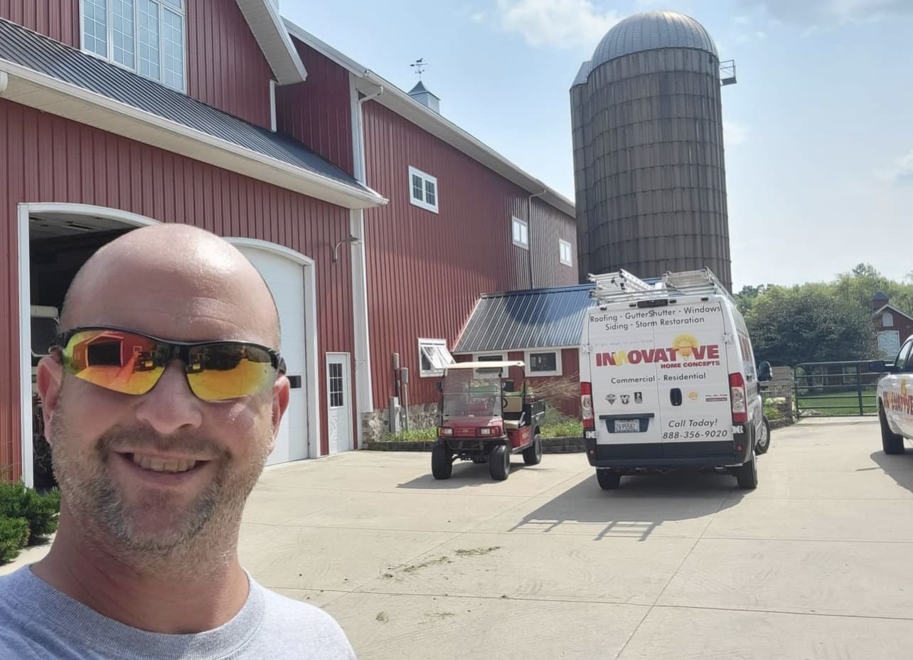IHC technician Nate at a GutterShutter installation job site in McHenry County
