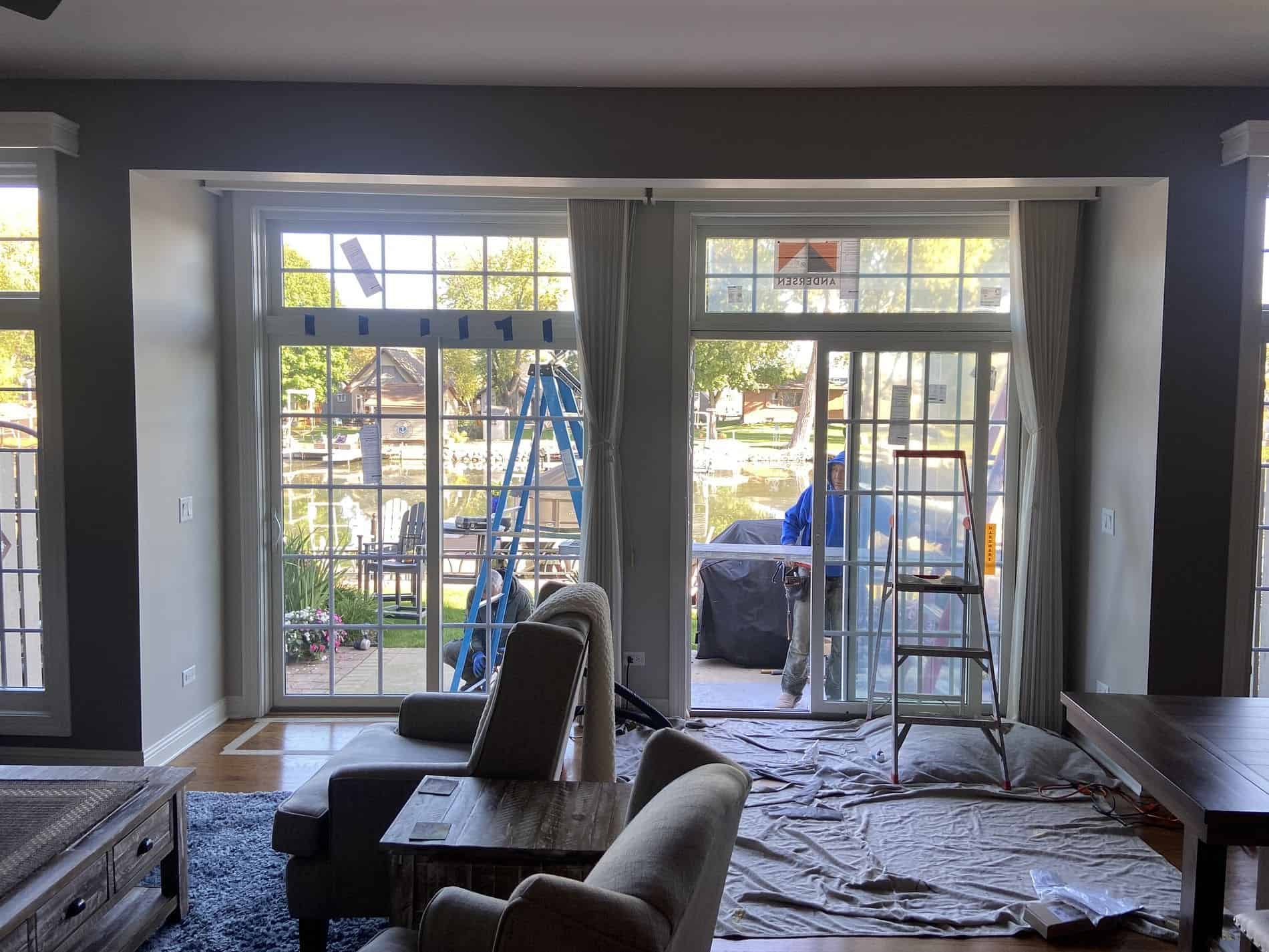 Andersen patio door with transom window letting natural light flood a McHenry County living room