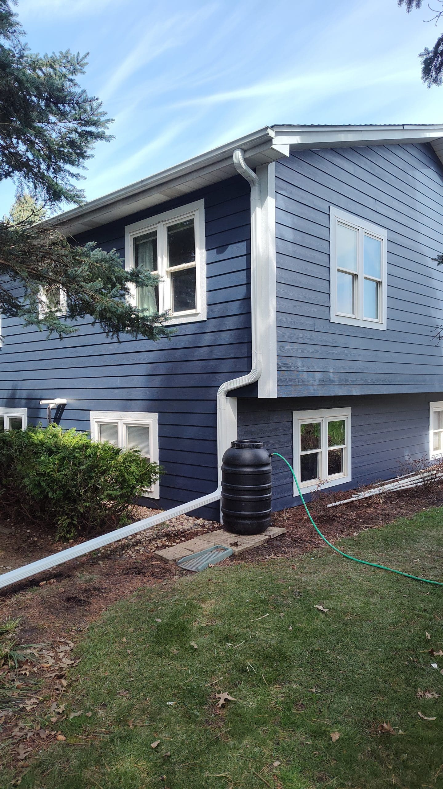 Blue vinyl lap siding installed on a McHenry County home