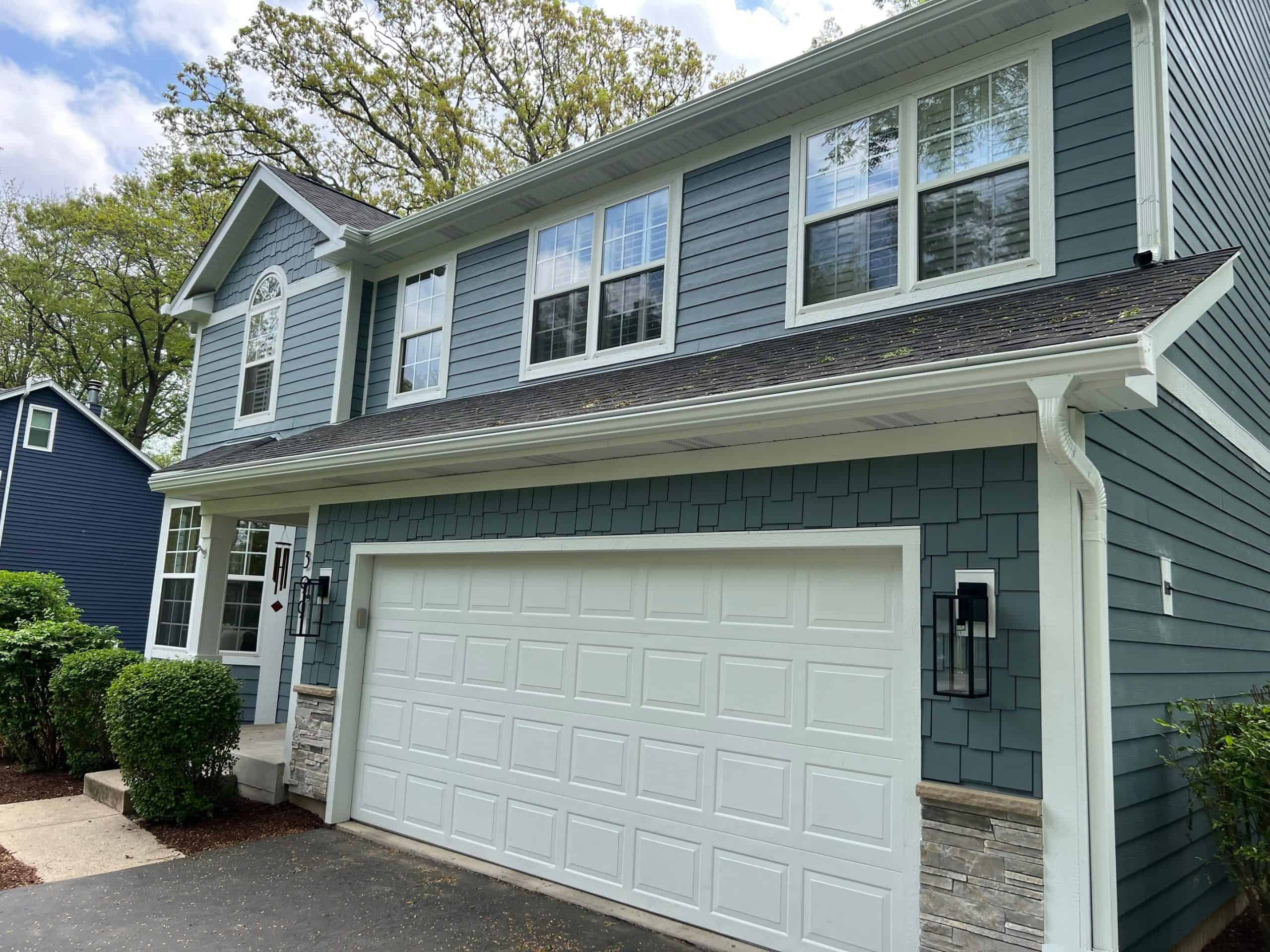 HardieShingle cedar-shake-look siding on finished McHenry County home paired with HardiePlank lap
