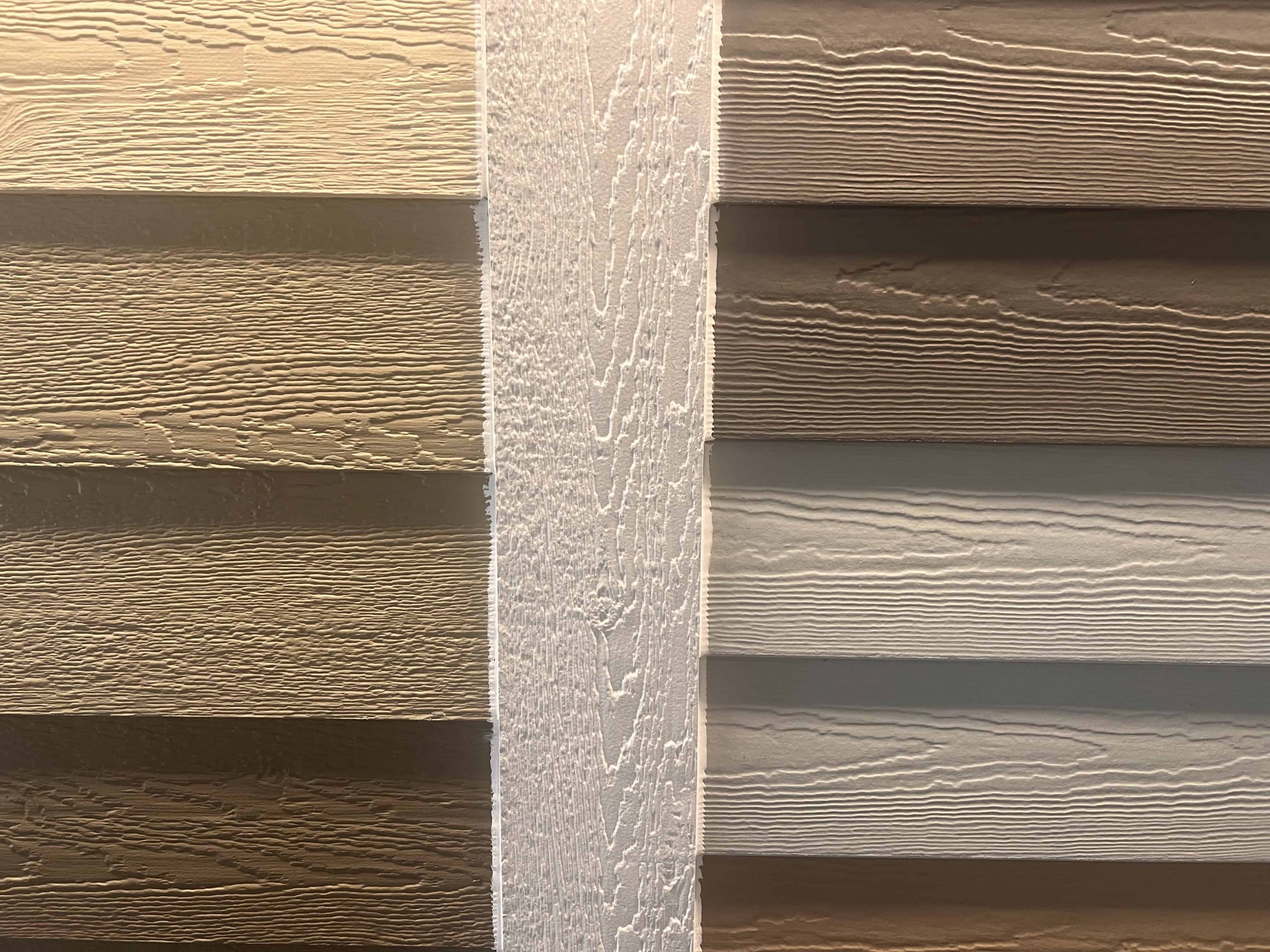 James Hardie and LP SmartSide siding samples side by side