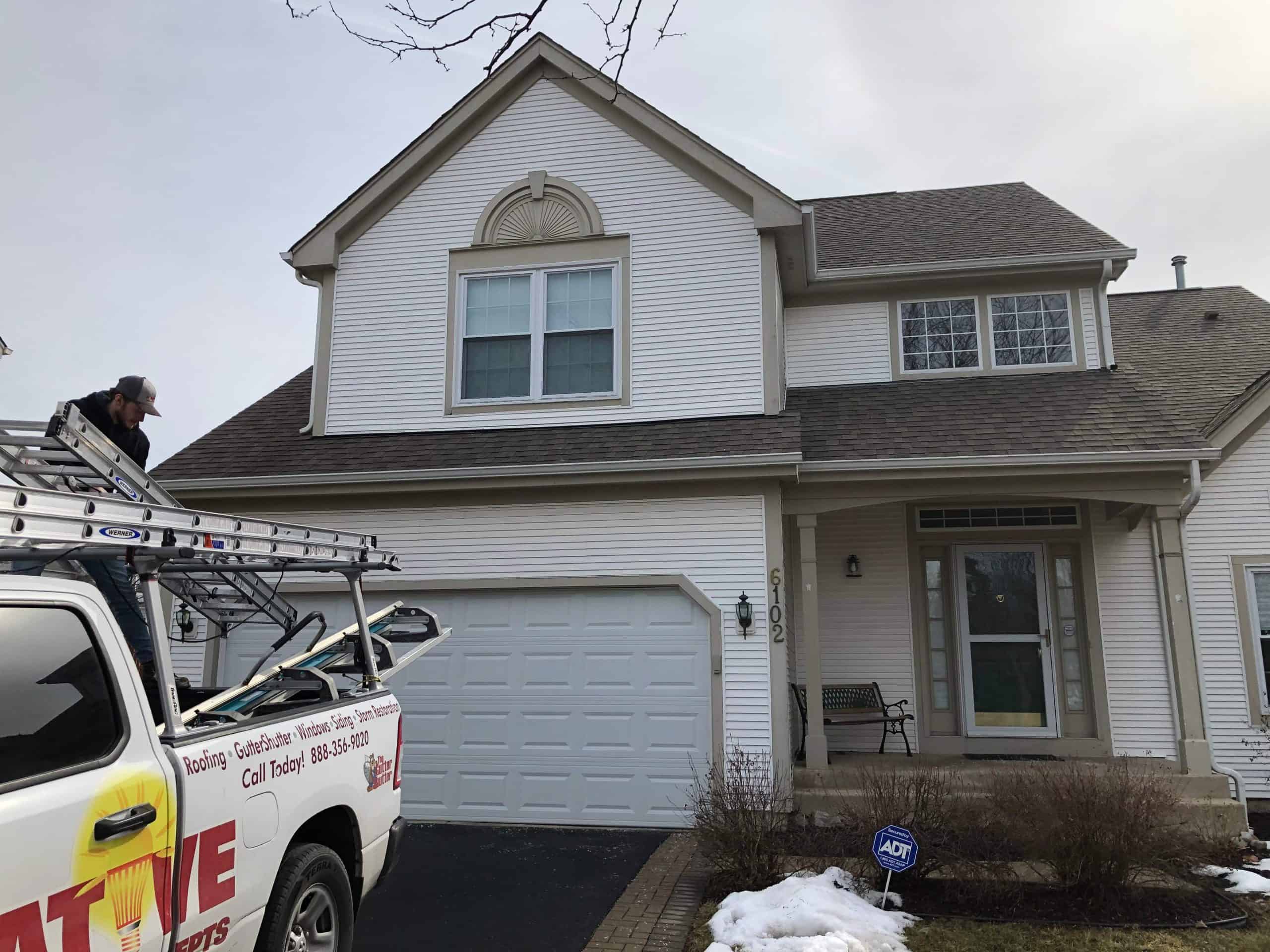 Innovative Home Concepts worker cleaning up after completing an installation