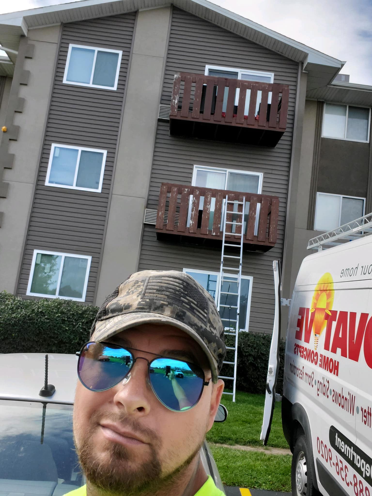 IHC inspecting hail damage on a commercial roof in McHenry County