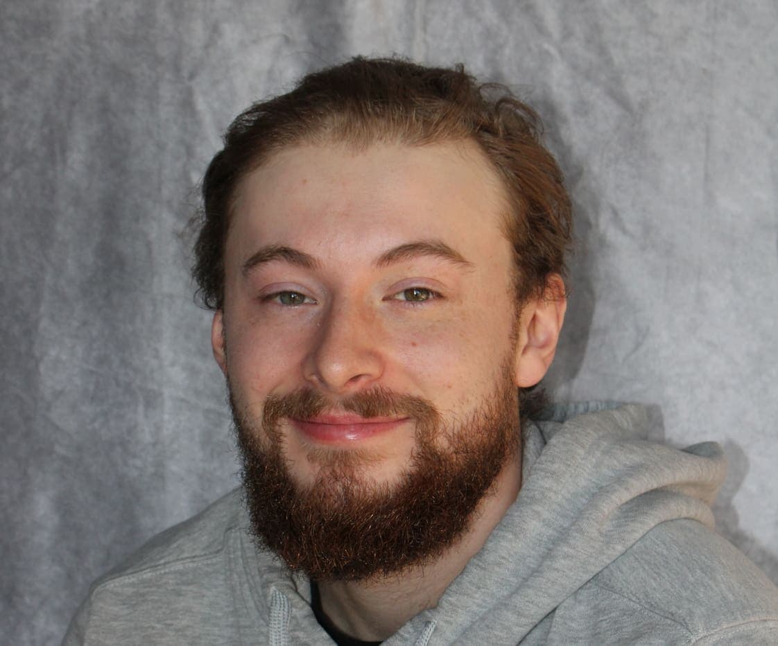 Skilled home renovation professional with a friendly smile.