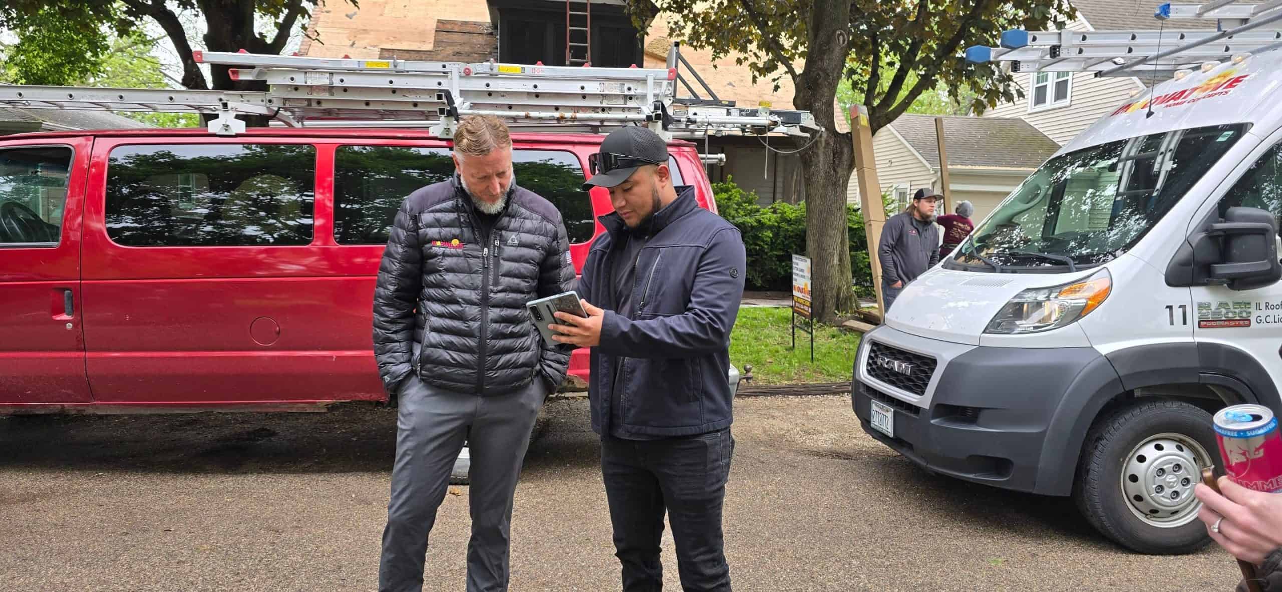 Innovative Home Concepts owner discussing a roofing project with the project manager on site