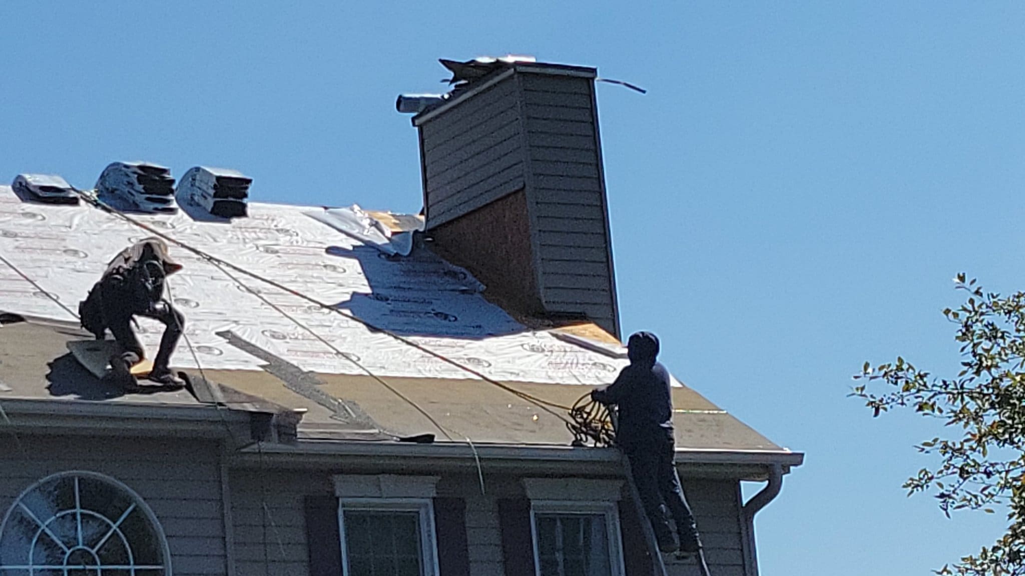 IHC crew repairing a roof in McHenry County