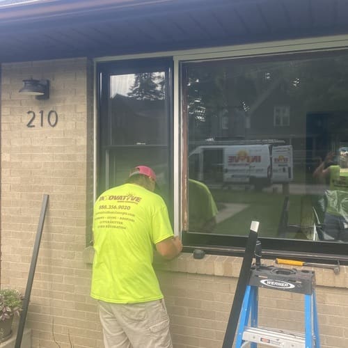 Repairing exterior trim around a window on a Crystal Lake home