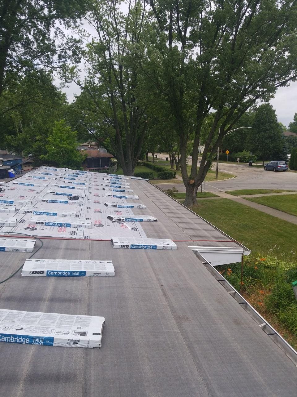 IHC crew installing a new roof after storm damage in McHenry County