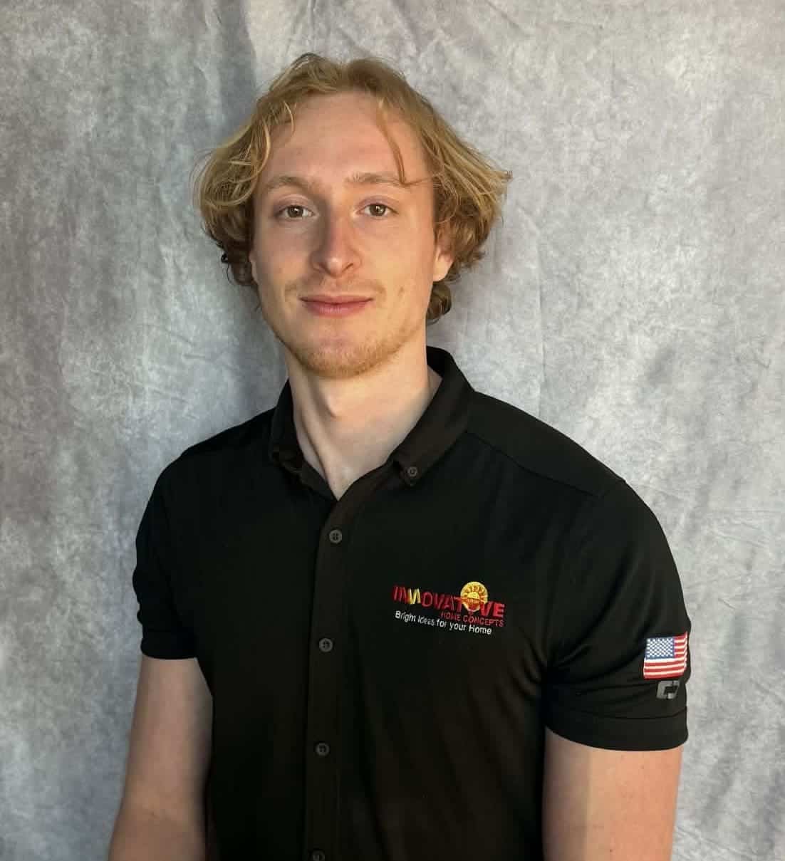 Young man in black polo shirt with Innovative Home Concepts logo.