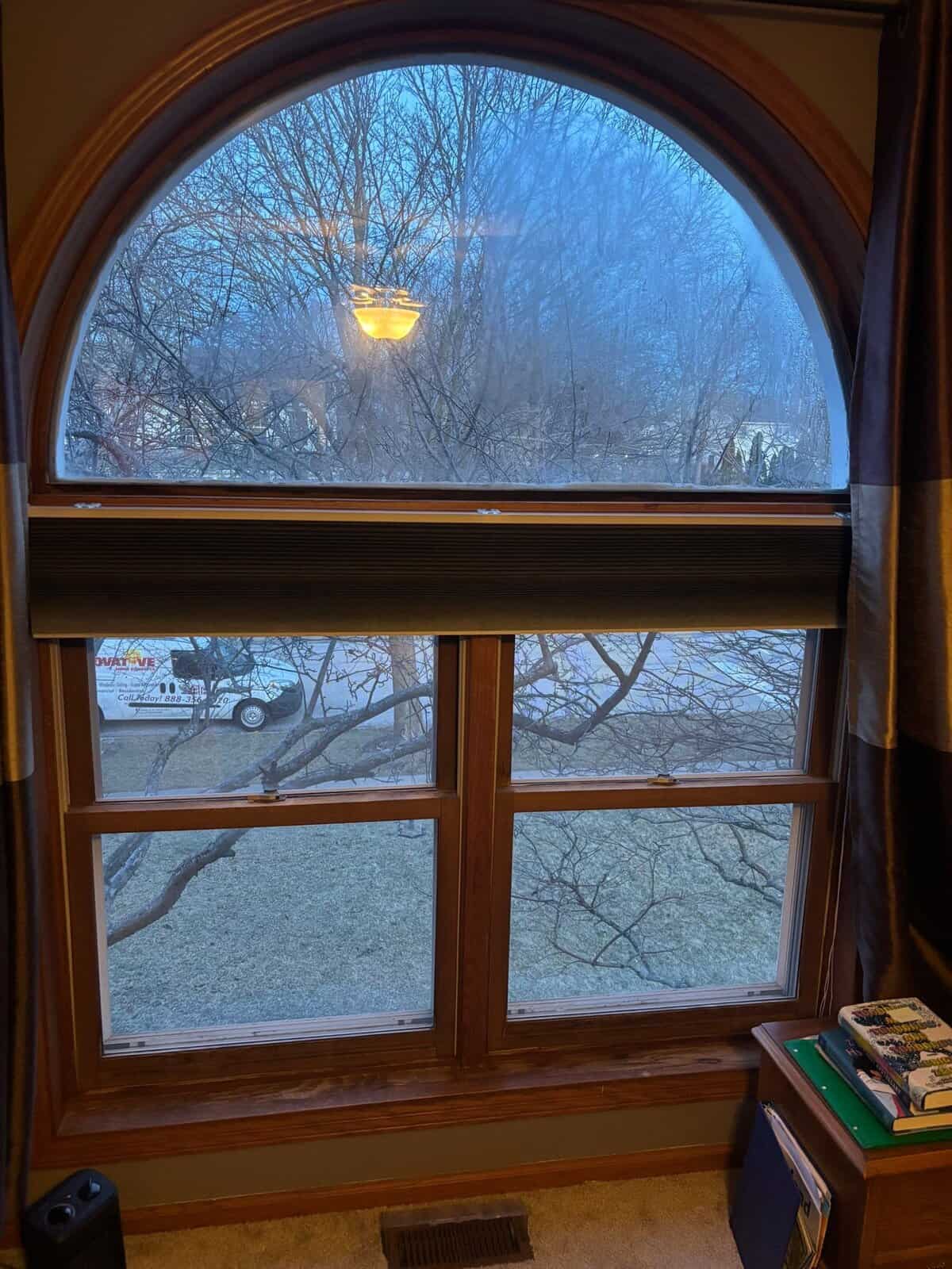 Andersen 400 Series arched window with wood interior in Crystal Lake IL home