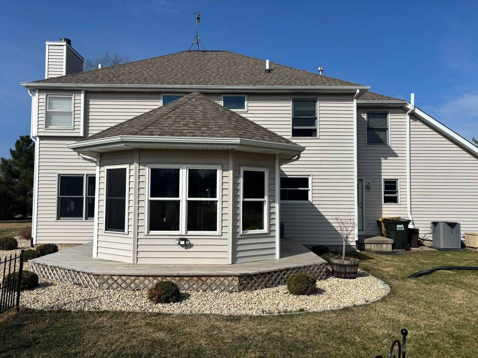 Rear view of home with Andersen windows and sunroom installed by IHC