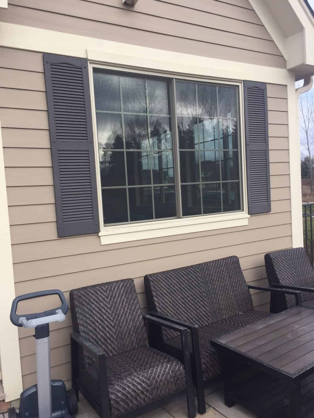 Window and siding before at Belfield Rd Crystal Lake