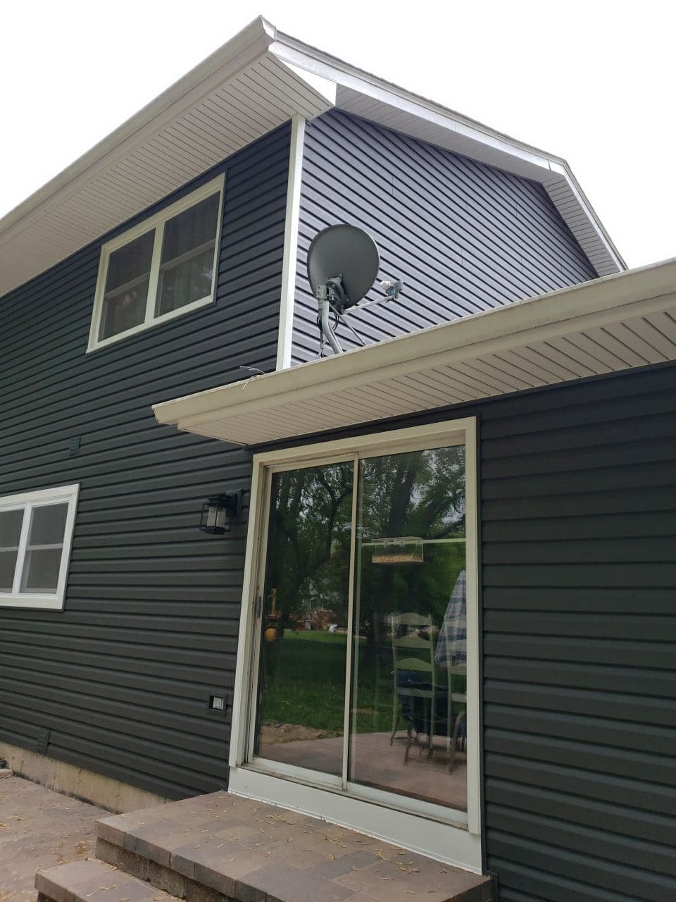 New charcoal vinyl siding side view with slider door at Mark Ct, Woodstock IL