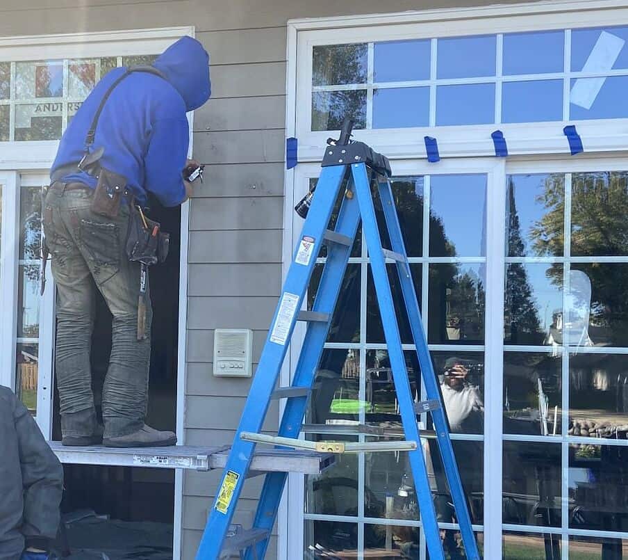 IHC crew installing Andersen 100 Series windows in McHenry County