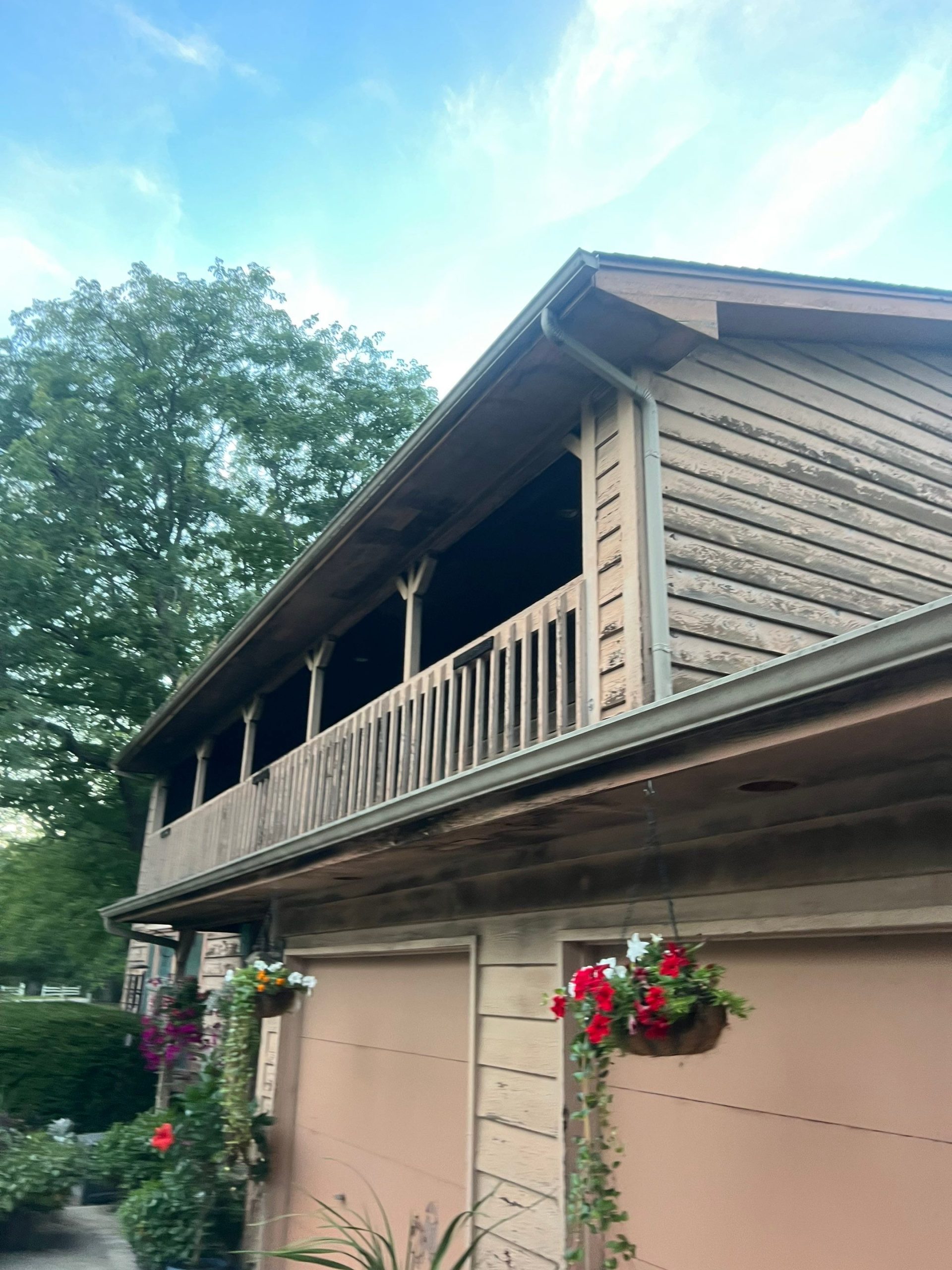 East Hillshire Drive Richmond IL — before, weathered cedar siding and old wood balcony