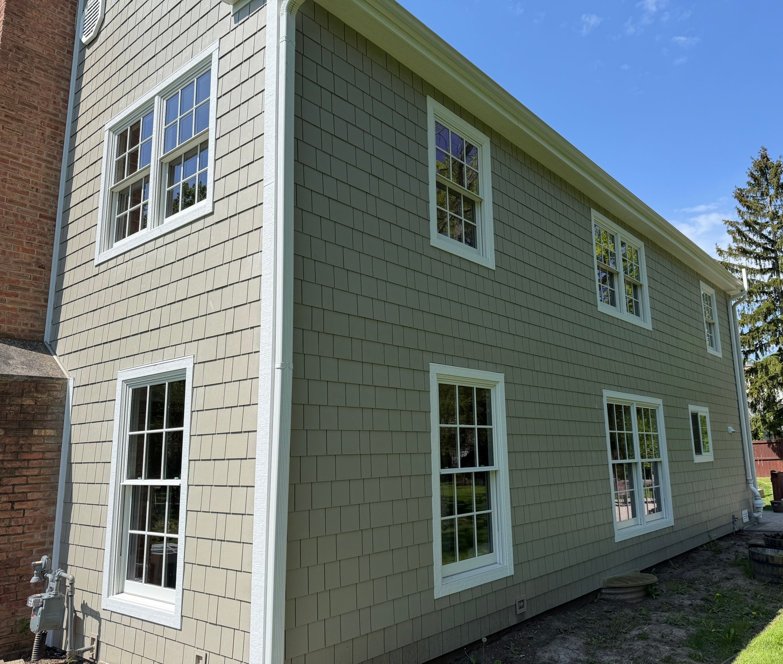 Farm Road Lake Forest IL after — James Hardie siding, Andersen windows, new fascia, soffit, roof, and gutters