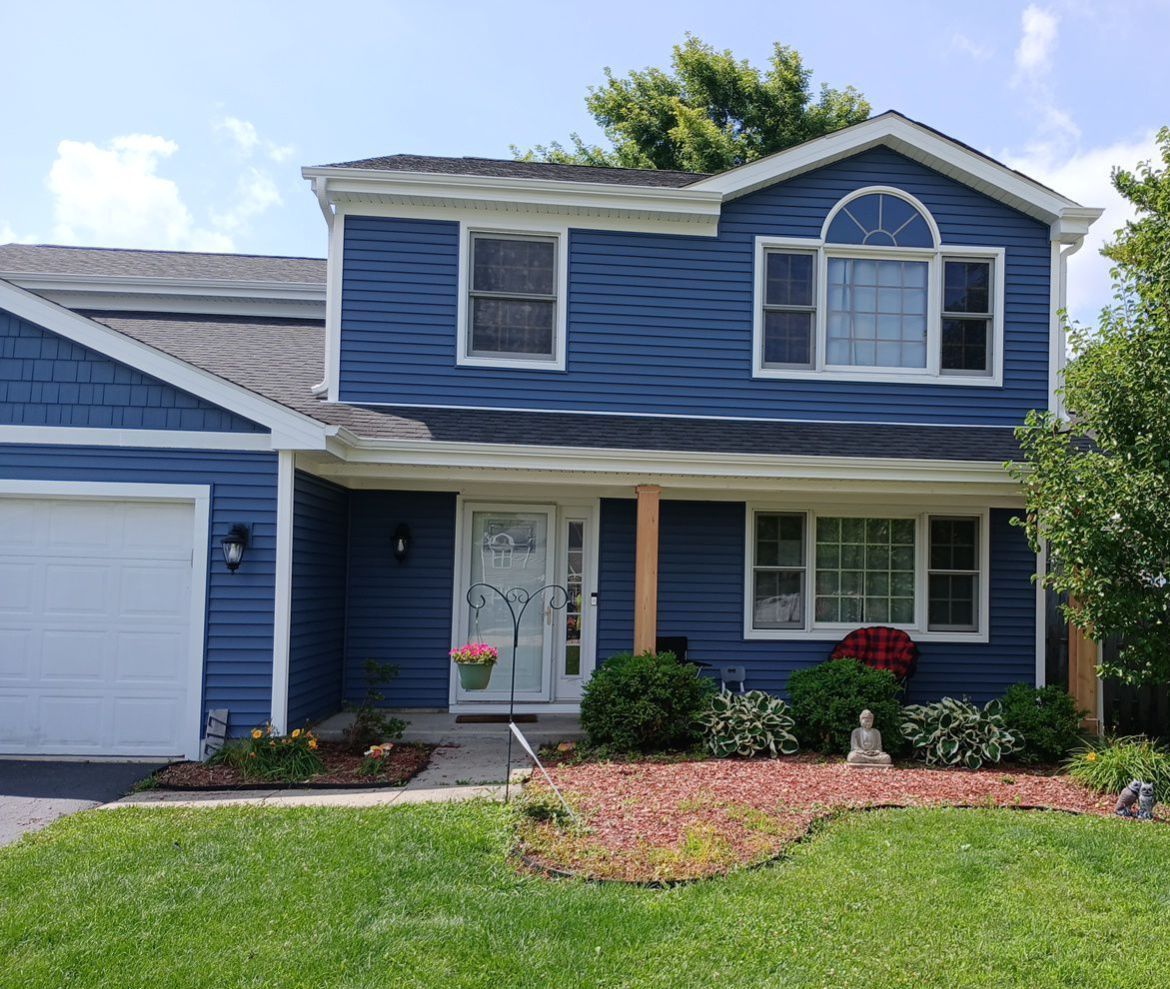 Greenmeadow Court Crystal Lake IL after — James Hardie blue lap siding, new roof, fascia, soffit, and gutters