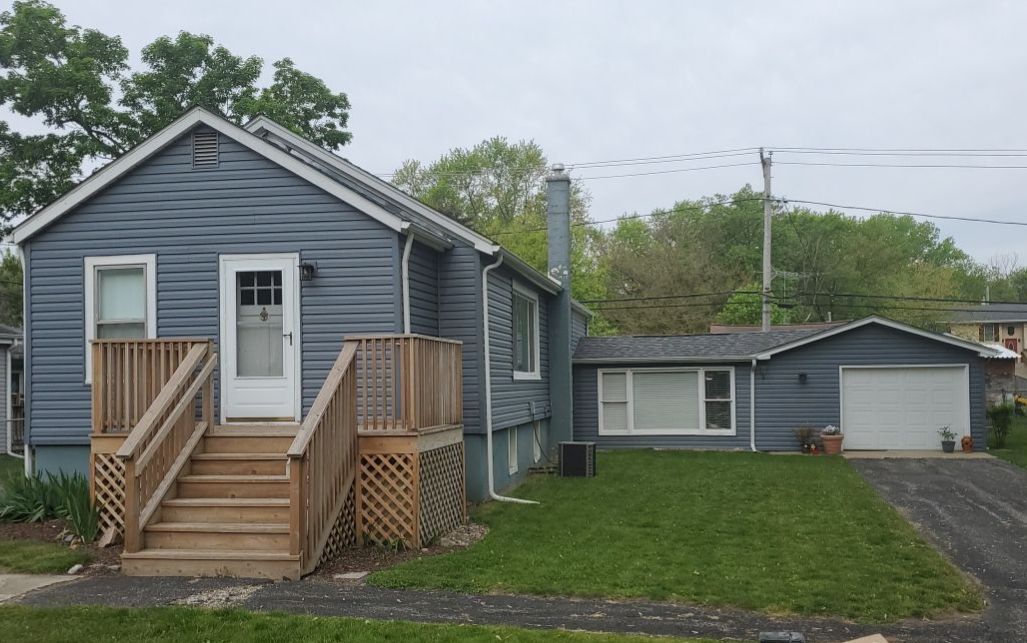 Lily Lake Road McHenry IL after — new slate blue vinyl siding and new gutters
