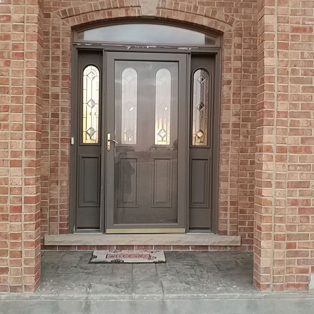 Margaret Court McHenry IL before — existing brown entry door with sidelights