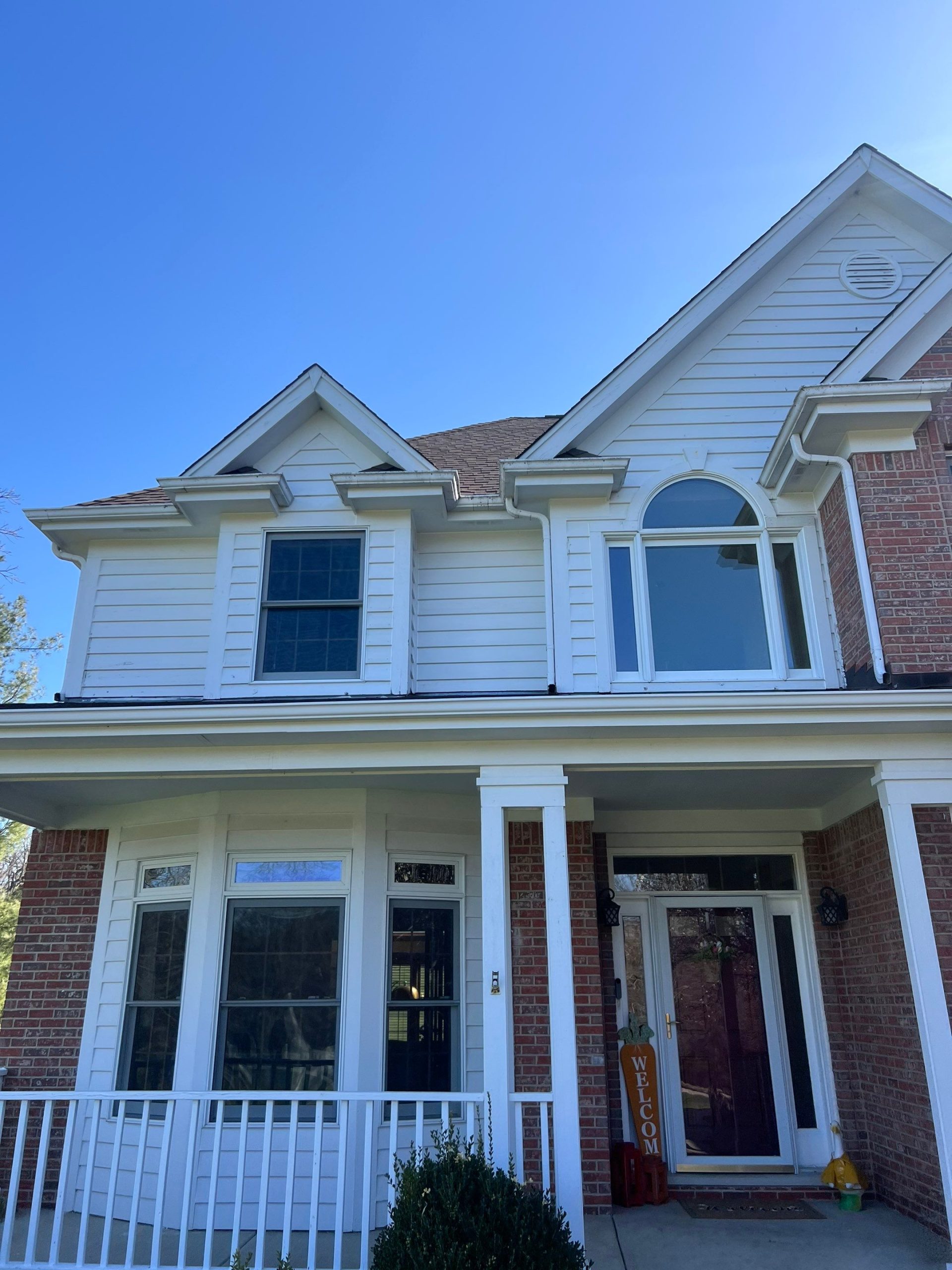 Niblick Court Crystal Lake IL before — aged gutters on traditional brick and white siding home
