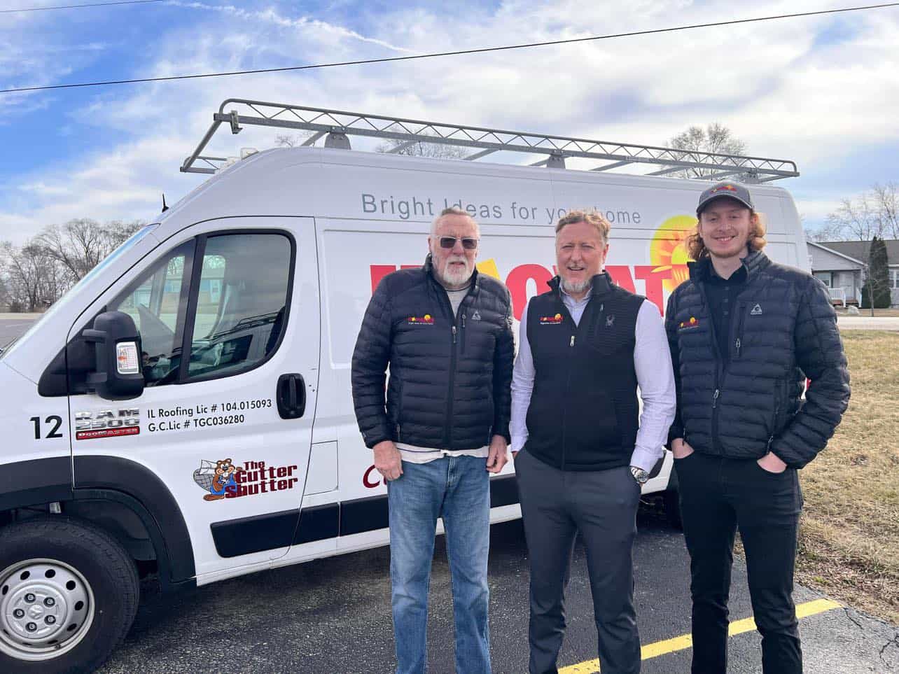 Three generations of the Wilborn family standing in front of an Innovative Home Concepts service van in Crystal Lake, Illinois