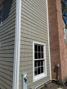 Close detail of James Hardie shake siding and trim on a finished Lake Forest home