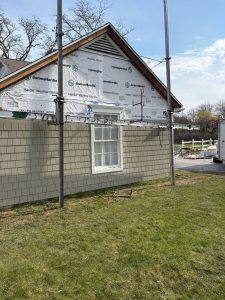 James Hardie shake siding being installed over the weather barrier by a certified IHC crew